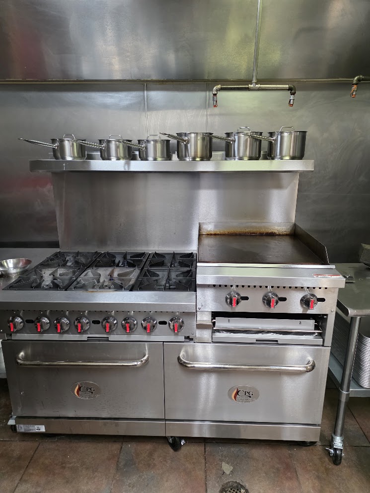 Commercial range and flat top in The Unseen Chef Studio kitchen